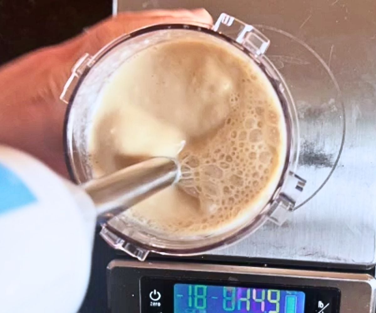 Blending a pint cup of peanut butter ice cream.