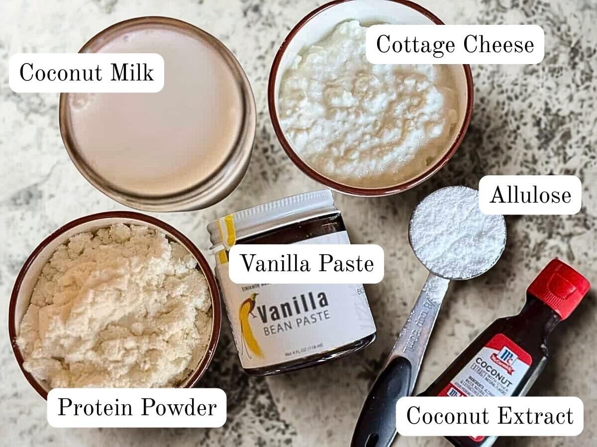 Ingredients for the coconut protein ice cream on a granite table.