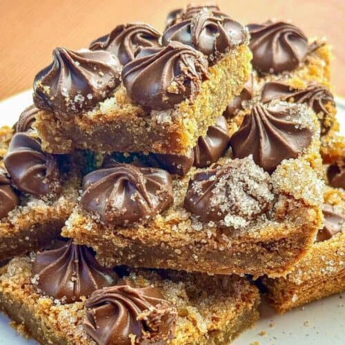 peanut butter blossom bars stacked on top of each other