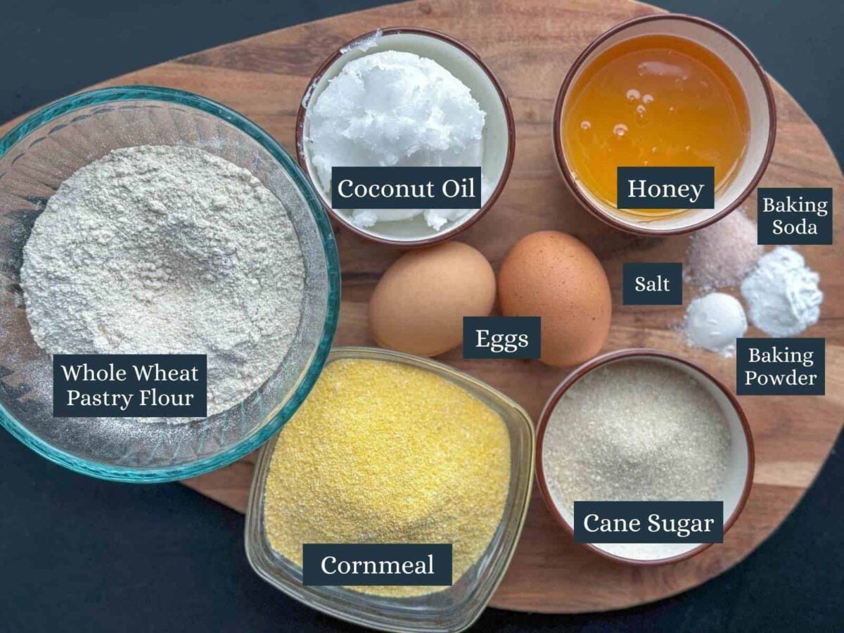 simple cornbread recipe without milk ingredients on wooden cutting board.