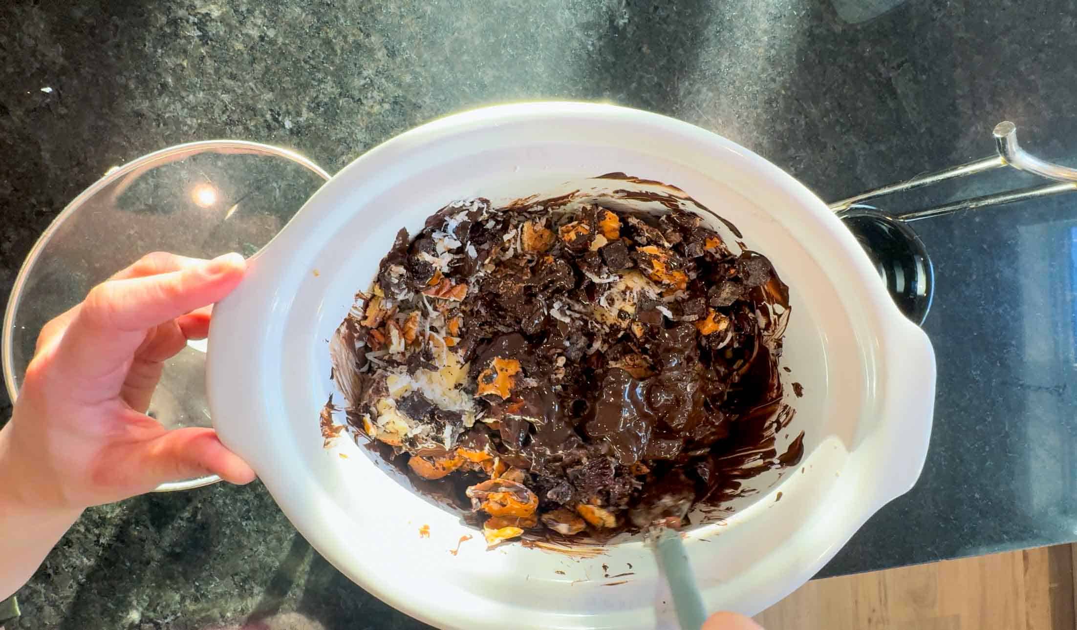 stirring partially melted crockpot christmas crack ingredients