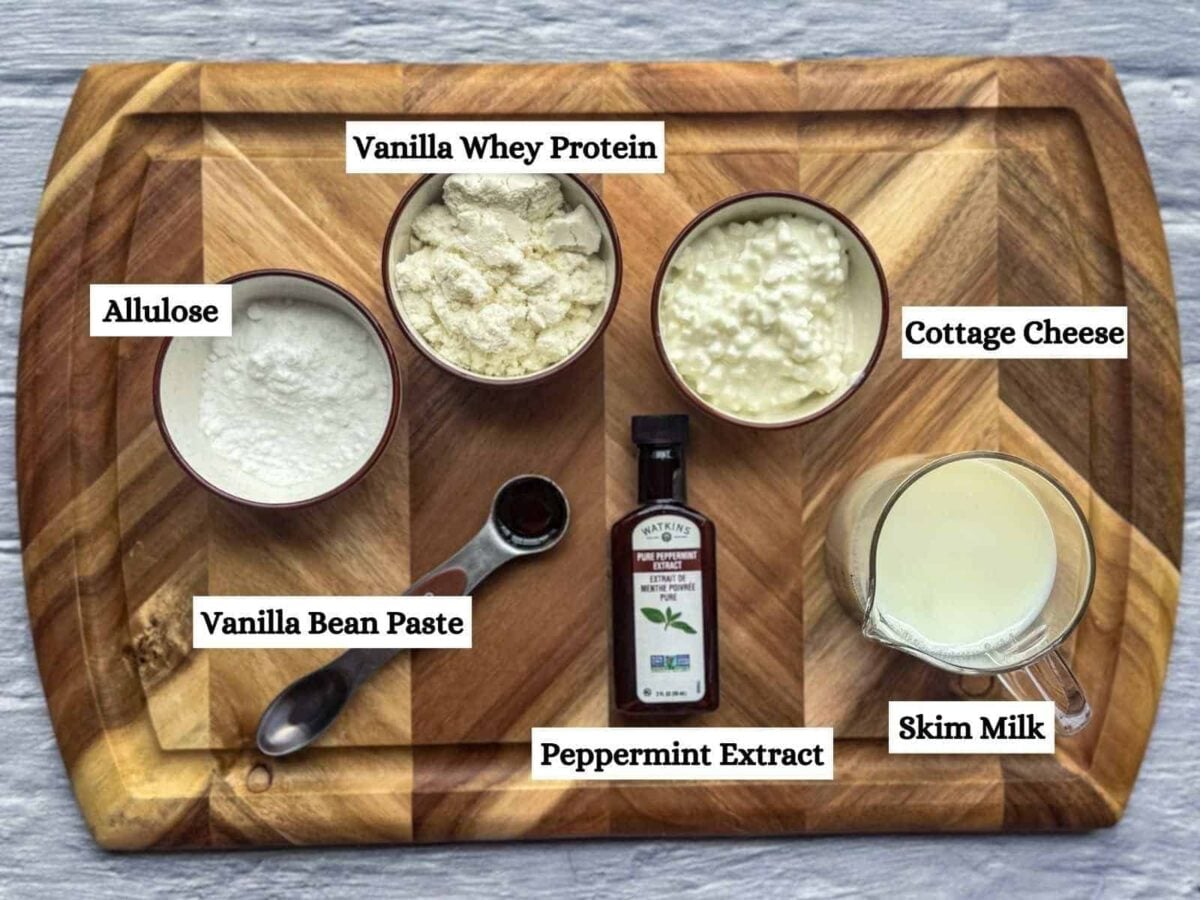 Ninja Creami Mint Chocolate Chip ice cream ingredients on wooden cutting board.