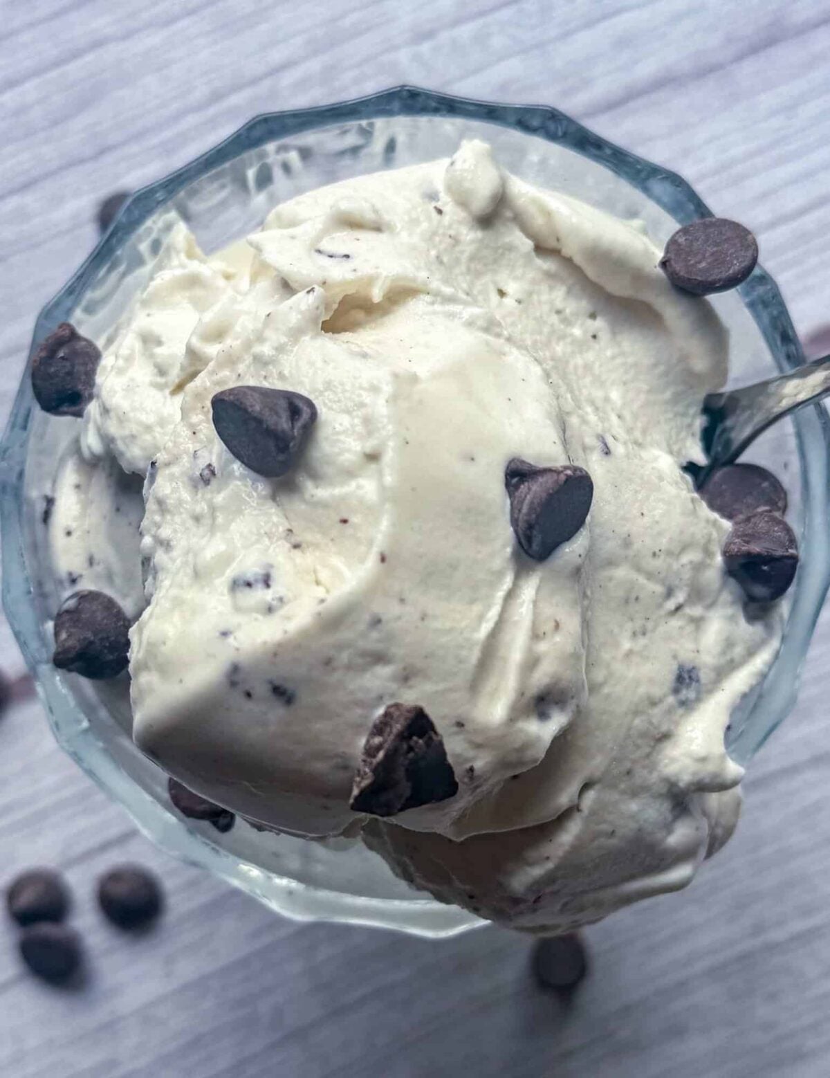 This is a dish of mint chocolate chip protein ice cream garnished with extra chocolate chips.