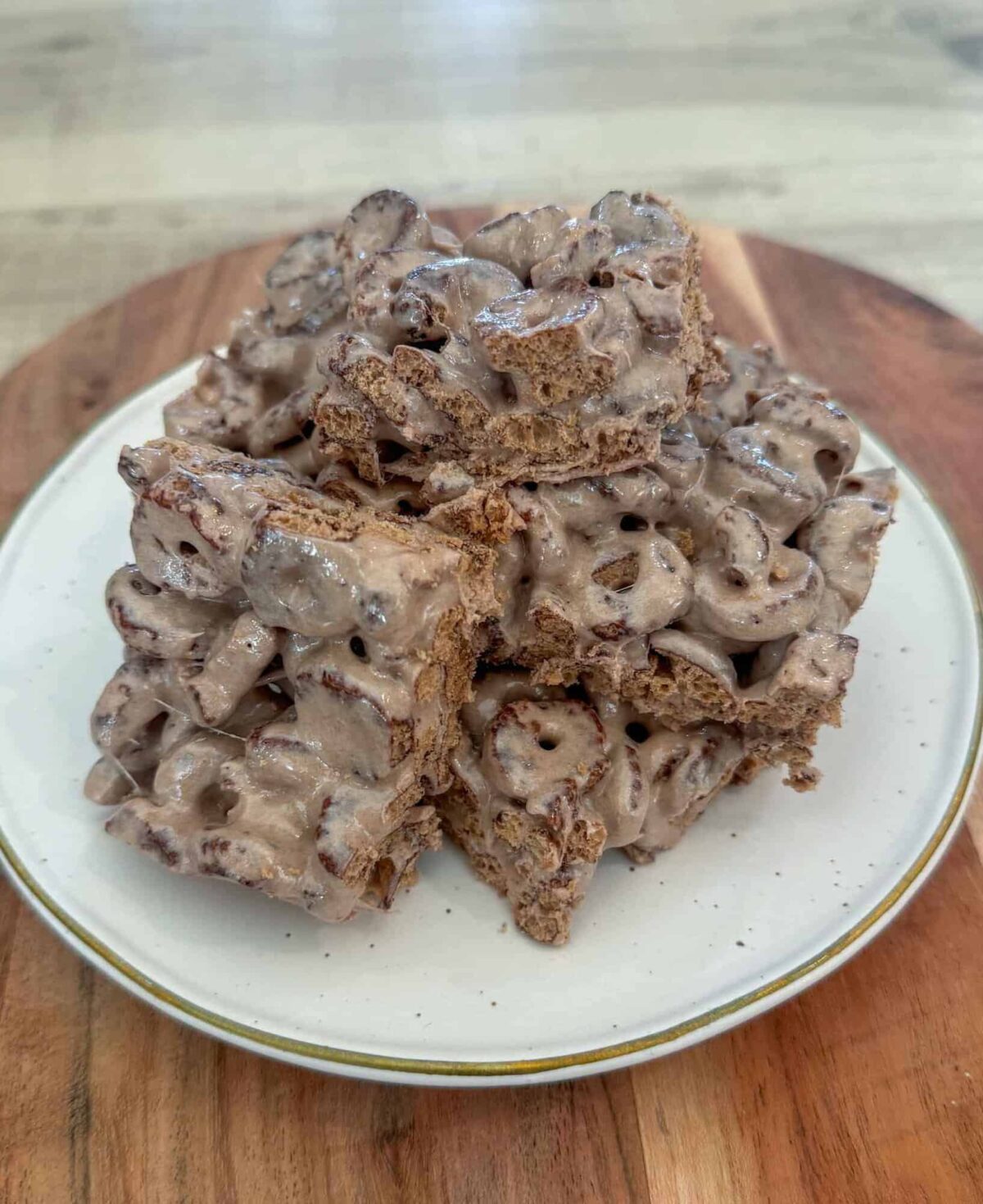 This is a stack of cereal protein bars on a white plate.