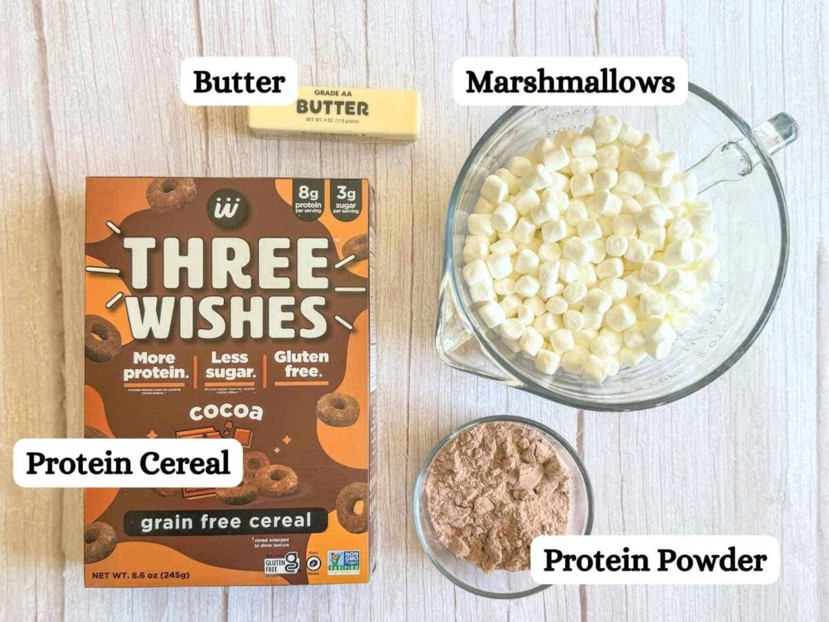 This is a box of cereal, bowl of marshmallows, protein powder, and a stick of butter.