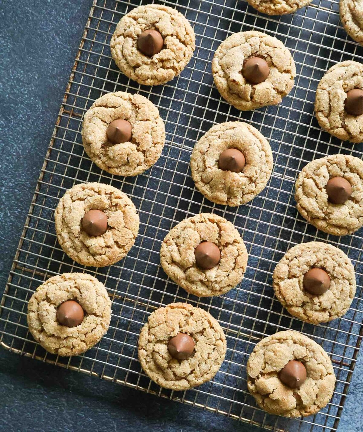A cooling rack of fresh milled peanut butter blossoms.