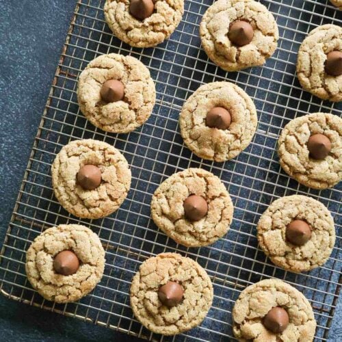 A cooling rack of whole wheat peanut butter christmas cookies.