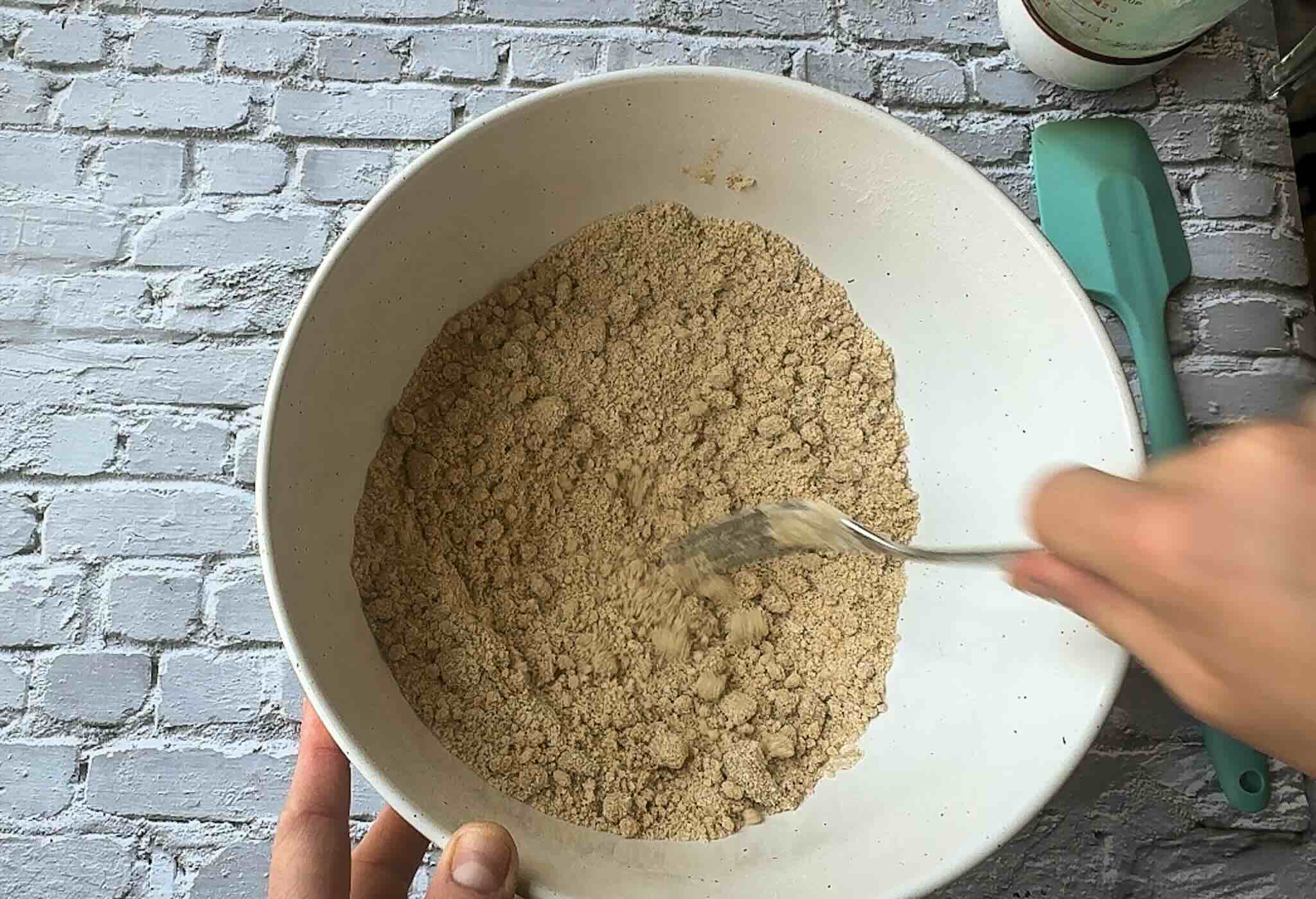 a bowl of flour mixed with melted butter to look like sand.