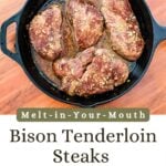 A cast iron skillet on wooden table with bison steaks.