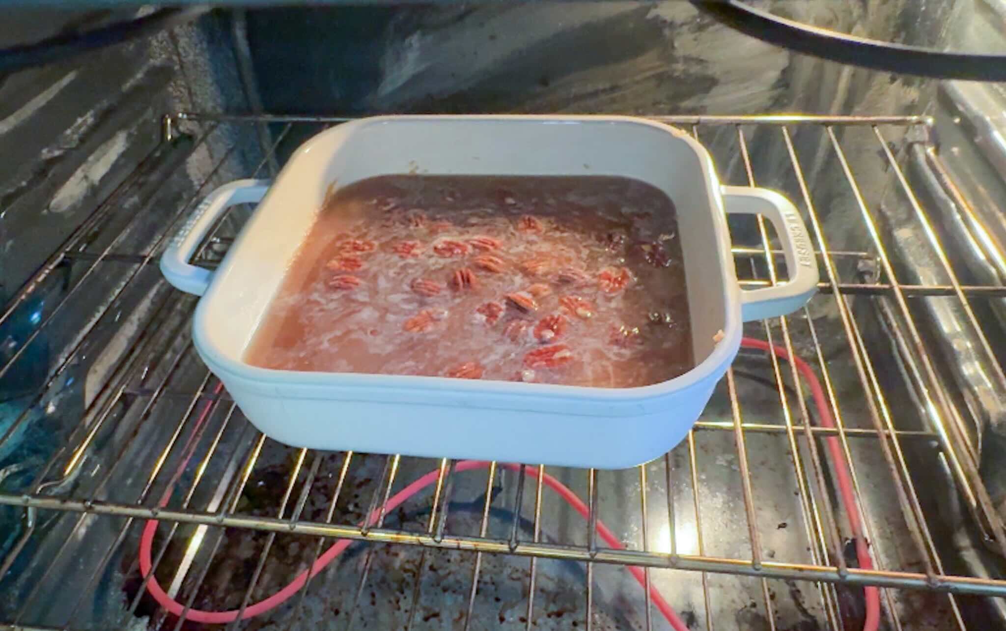 Apple cake baking dish in the oven.