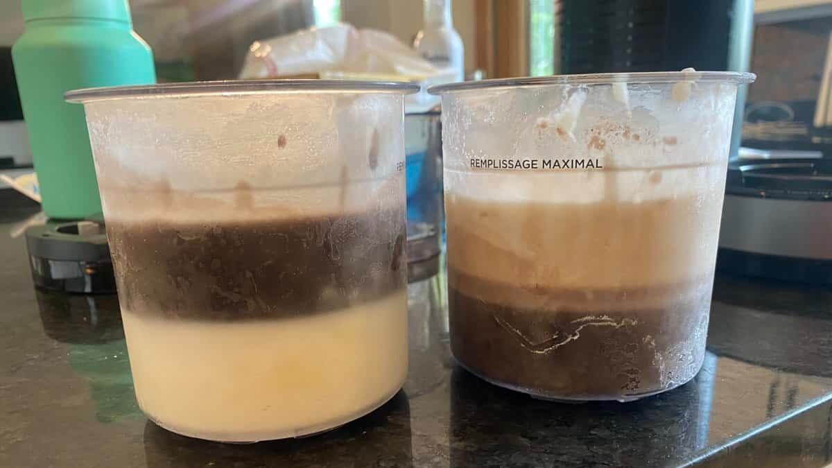 Frozen pints of layered ninja creami ice cream flavors.