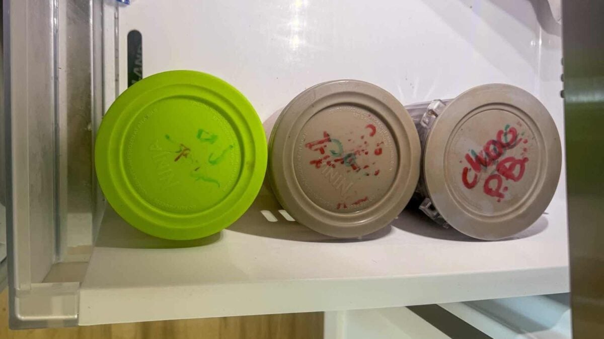 ninja creami pints lined up in freezer.